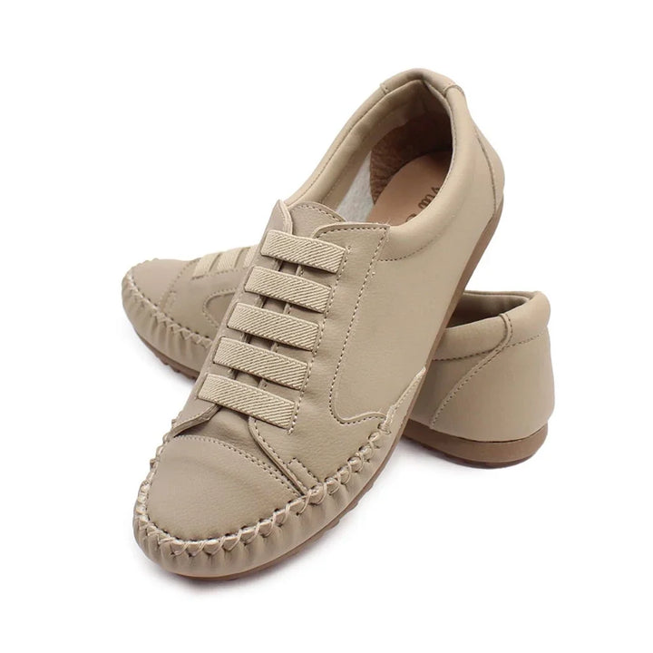 Full pair of women's casual footwear displayed on a clean studio background