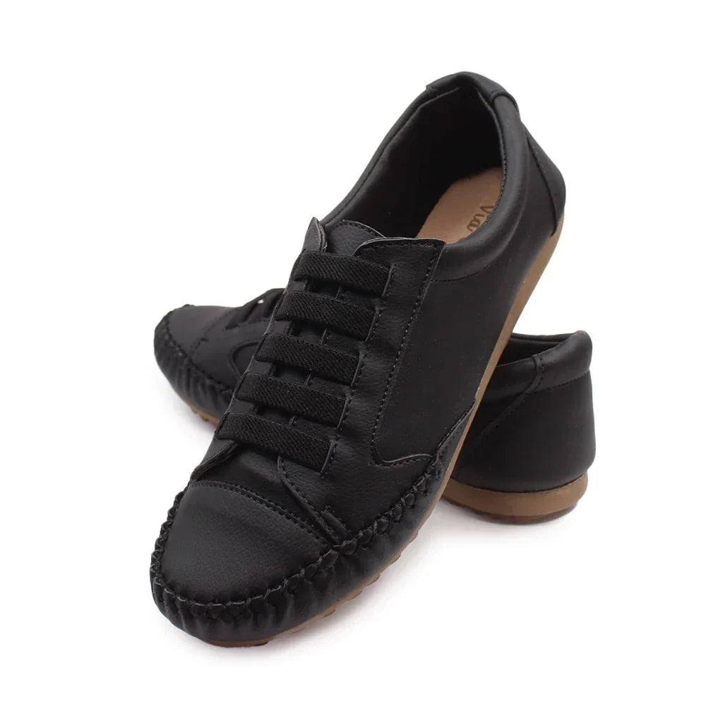 Detailed shot of stitching and premium material on women's trainers