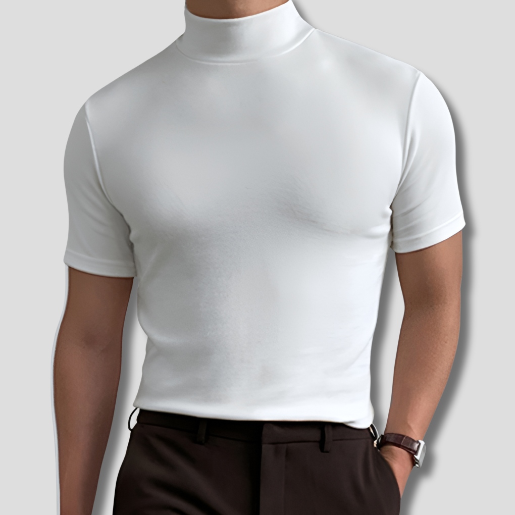 Man wearing white short sleeve turtleneck shirt with dark trousers