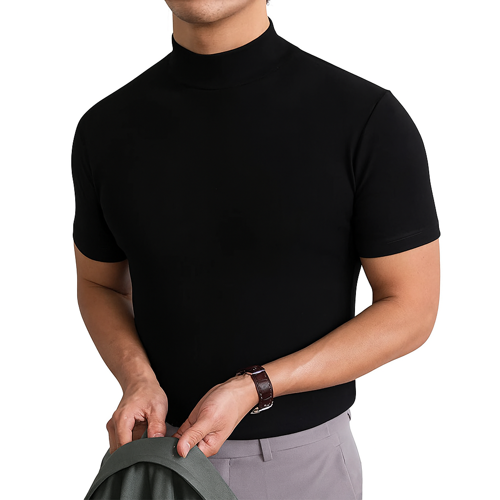 Man wearing black short sleeve turtleneck shirt holding a jacket