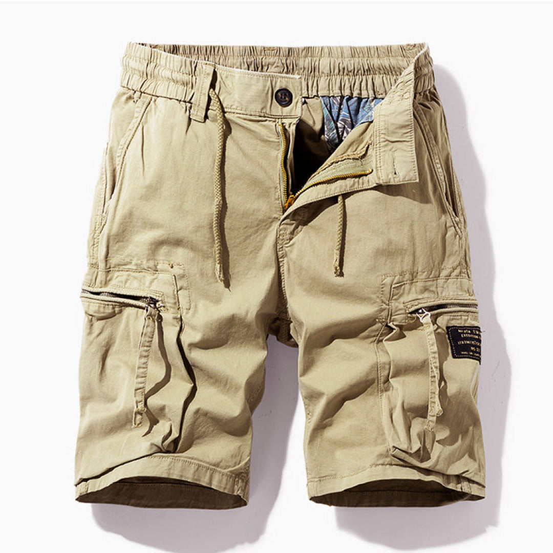 Khaki men cargo shorts laid flat showing elastic waistband and pockets