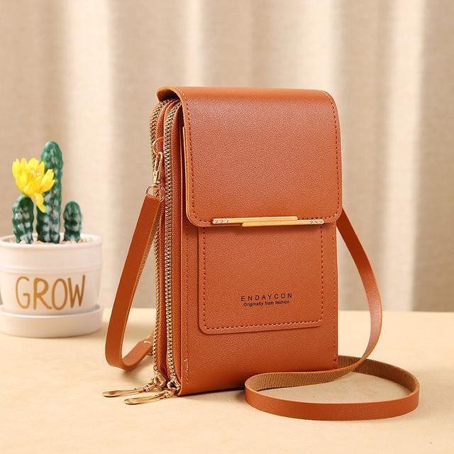 Lifestyle shot of crossbody phone pouch used as travel purse