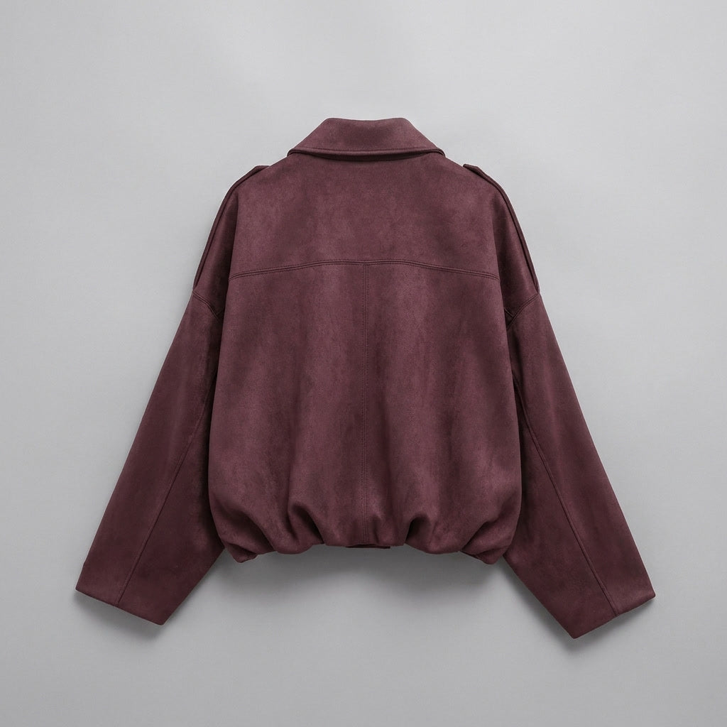 Back view of the burgundy cropped bomber jacket showing the tailored hem
