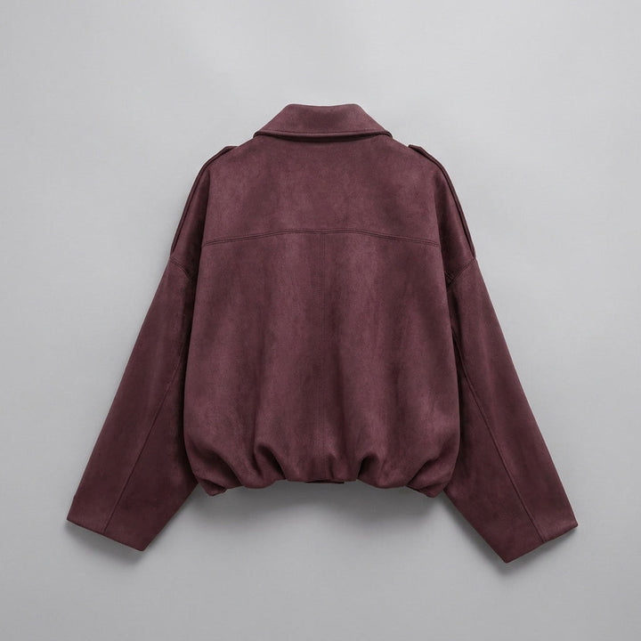 Back view of the burgundy cropped bomber jacket showing the tailored hem