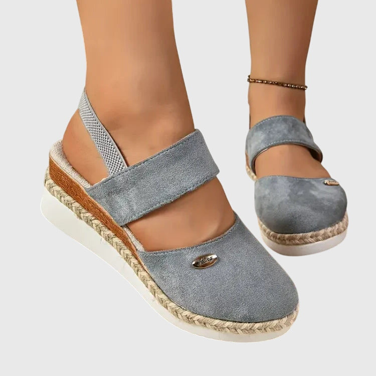 Close-up of comfortable footwear showing adjustable slingback buckle
