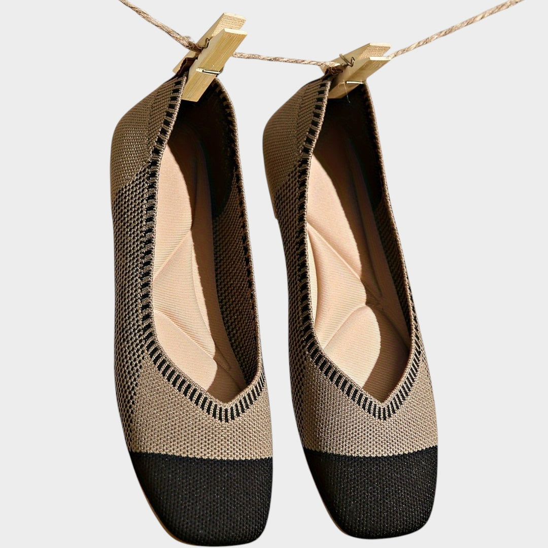 Women's woven square toe ballet flats hanging on a string in khaki and black colorway