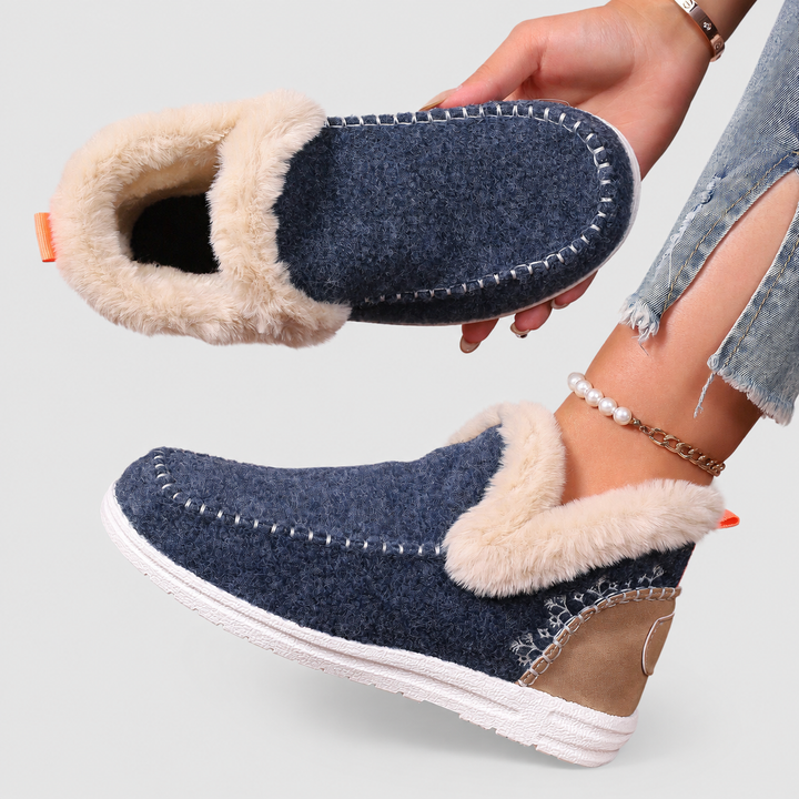 Indoor slippers for women showcasing plush fleece and orthopedic build