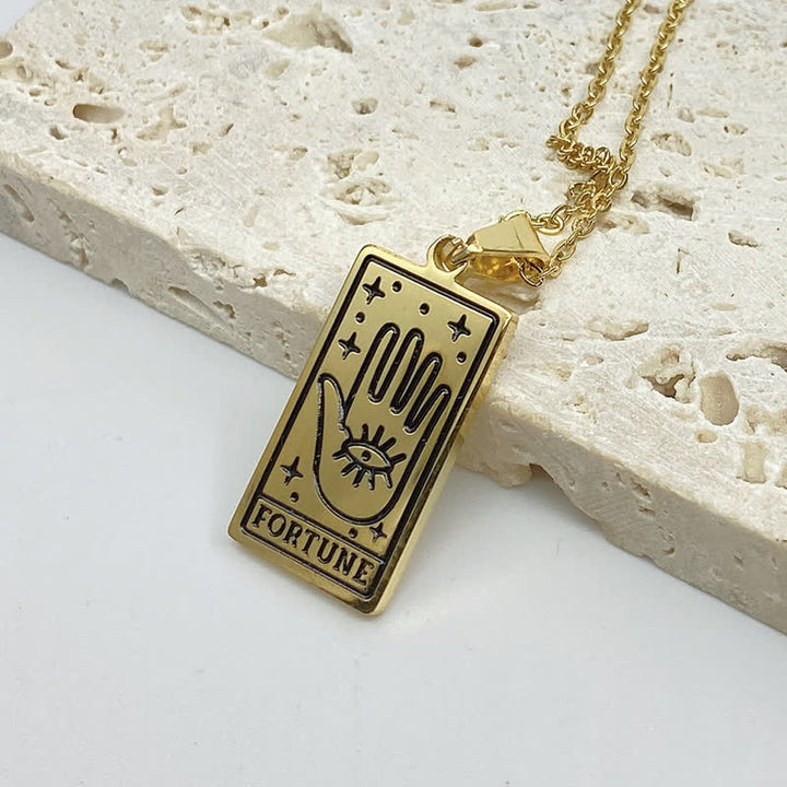 Gold tarot card pendant necklace presented as a fashion accessory