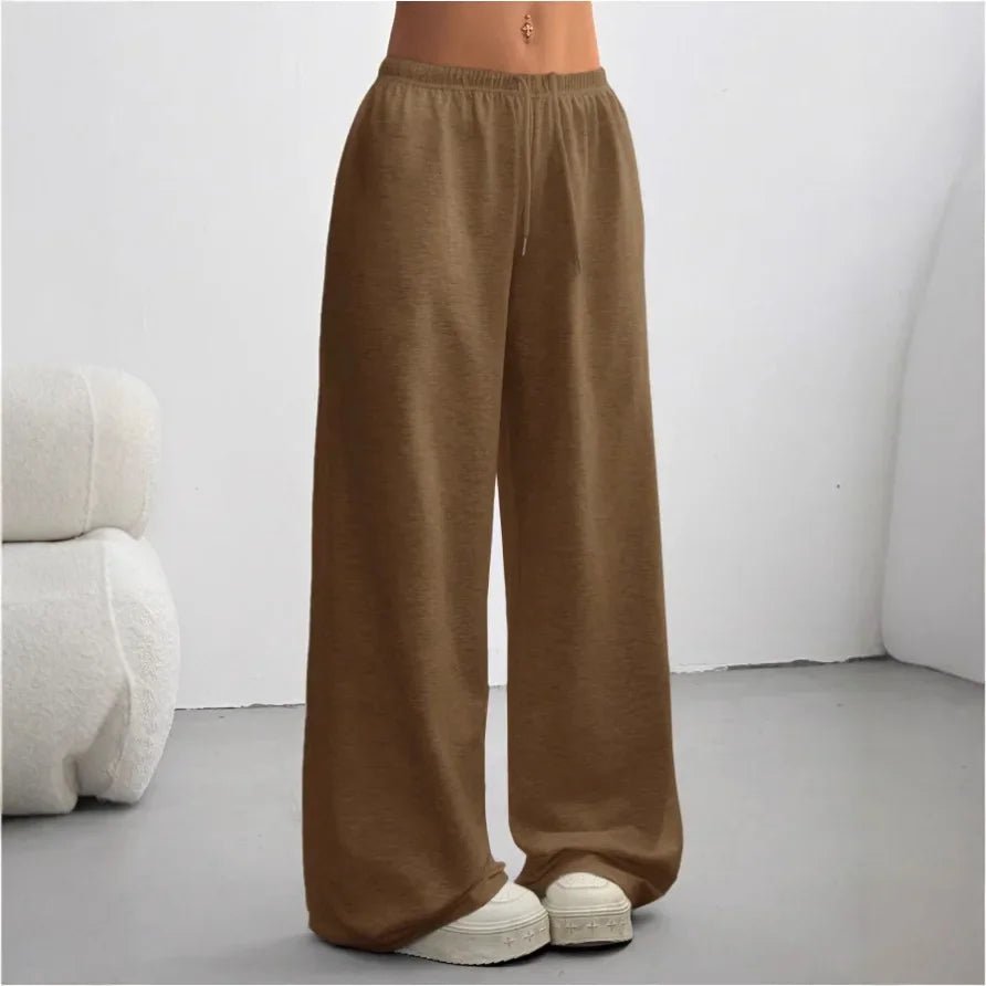 Model wearing Madeline casual wide-leg joggers in dark brown with sneakers