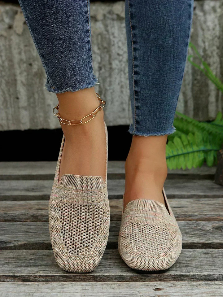 Close-up of women's orthopedic walking shoes worn with blue jeans