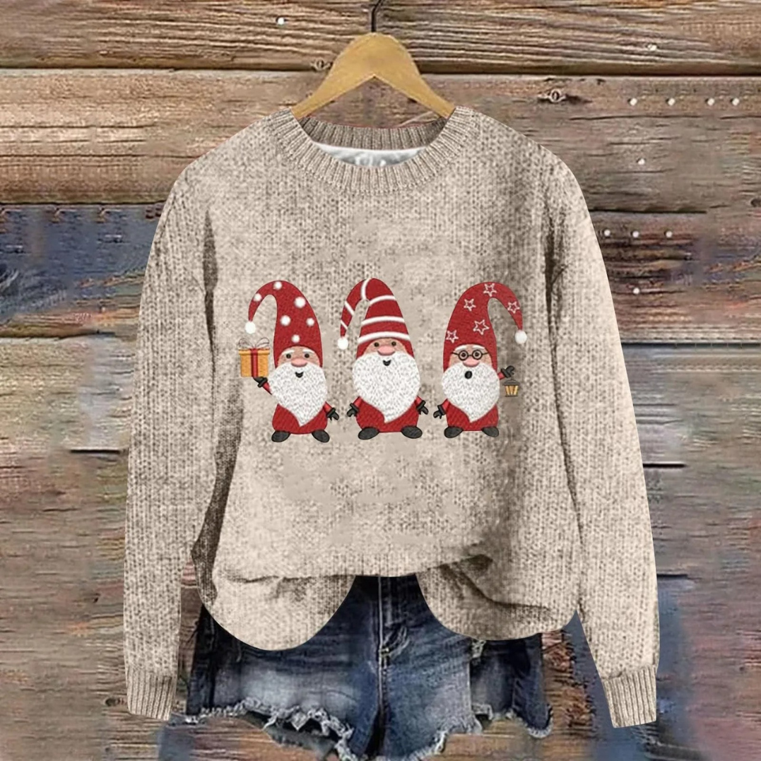 Folded holiday knit sweater stack displaying festive patterns for winter season