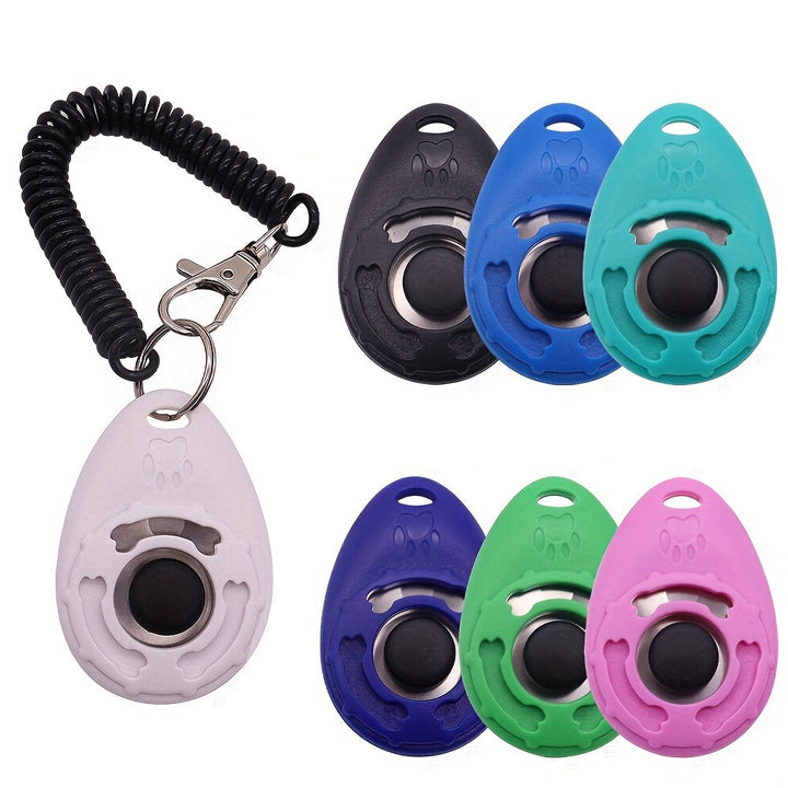 Collection of dog training clickers in various colors with black spiral cord
