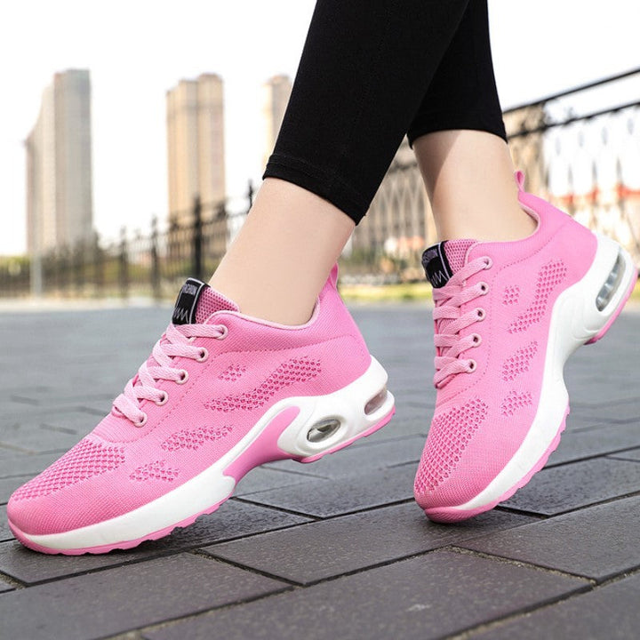 Top-down view of women's orthopedic walking shoes featuring breathable mesh upper and cushioned insole.