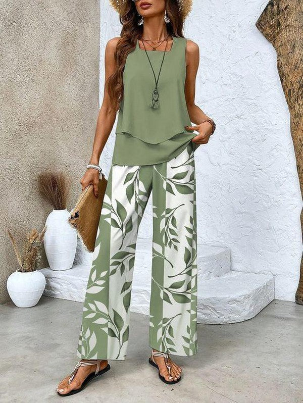 Model wearing Verde leaf print two-piece outfit with wide leg pants