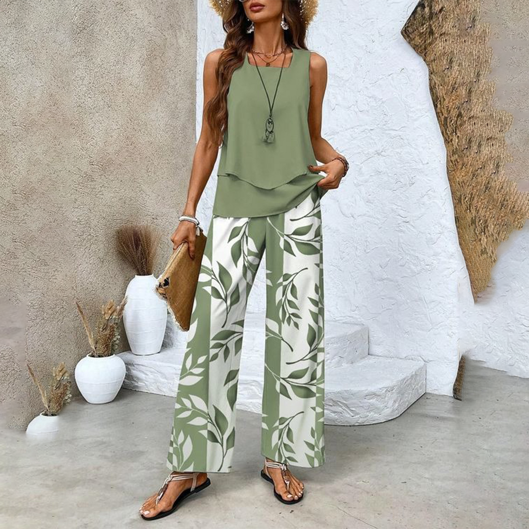 Close-up of Verde sleeveless layered top and patterned trousers