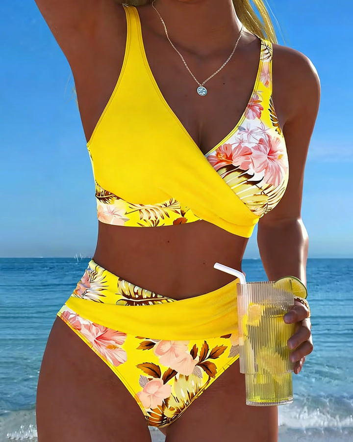 Women wearing yellow tropical floral high waist bikini set outdoors