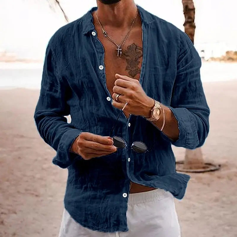 Man wearing navy blue long sleeve casual button-down shirt at the beach