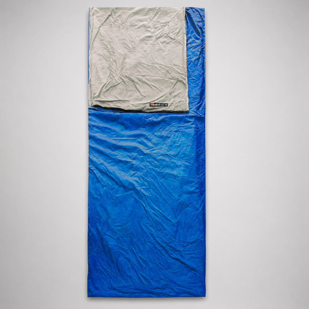 Blue portable rectangular sleep liner displayed vertically on a neutral background