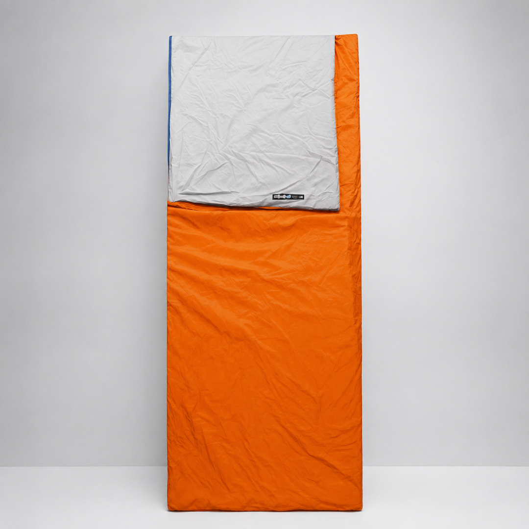 Bright orange portable rectangular sleep liner showing lightweight construction