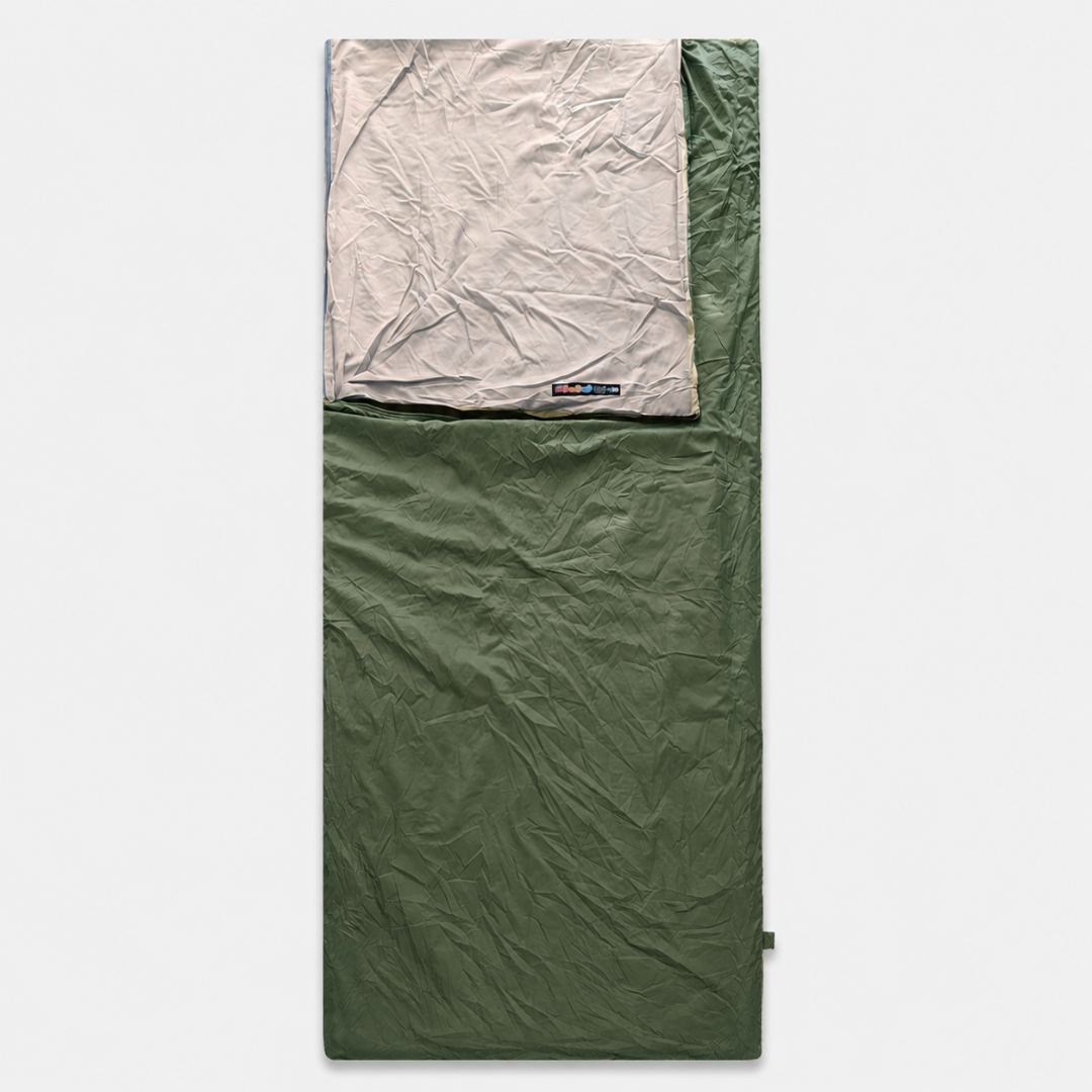 Lightweight sleep liner packed in its compact travel pouch for backpacking