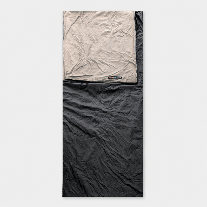 Travel sleep bag liner laid flat showing full rectangular dimensions