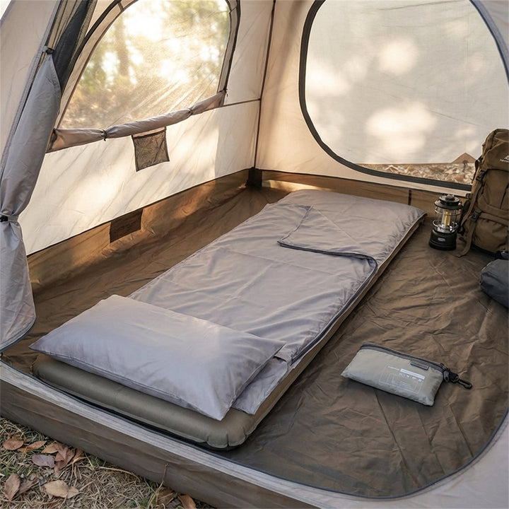 Hiker using rectangular sleep liner inside sleeping bag for camping warmth