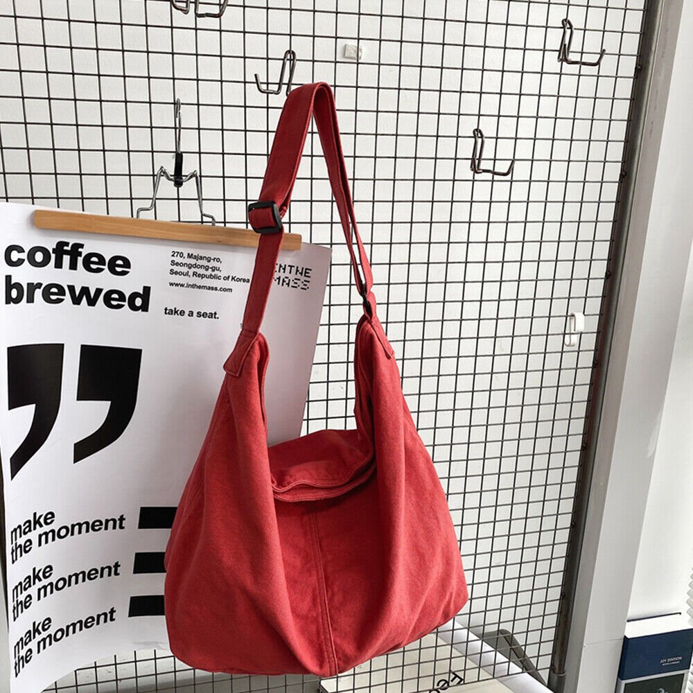 Casual canvas tote bag worn on shoulder as a convenient everyday travel bag