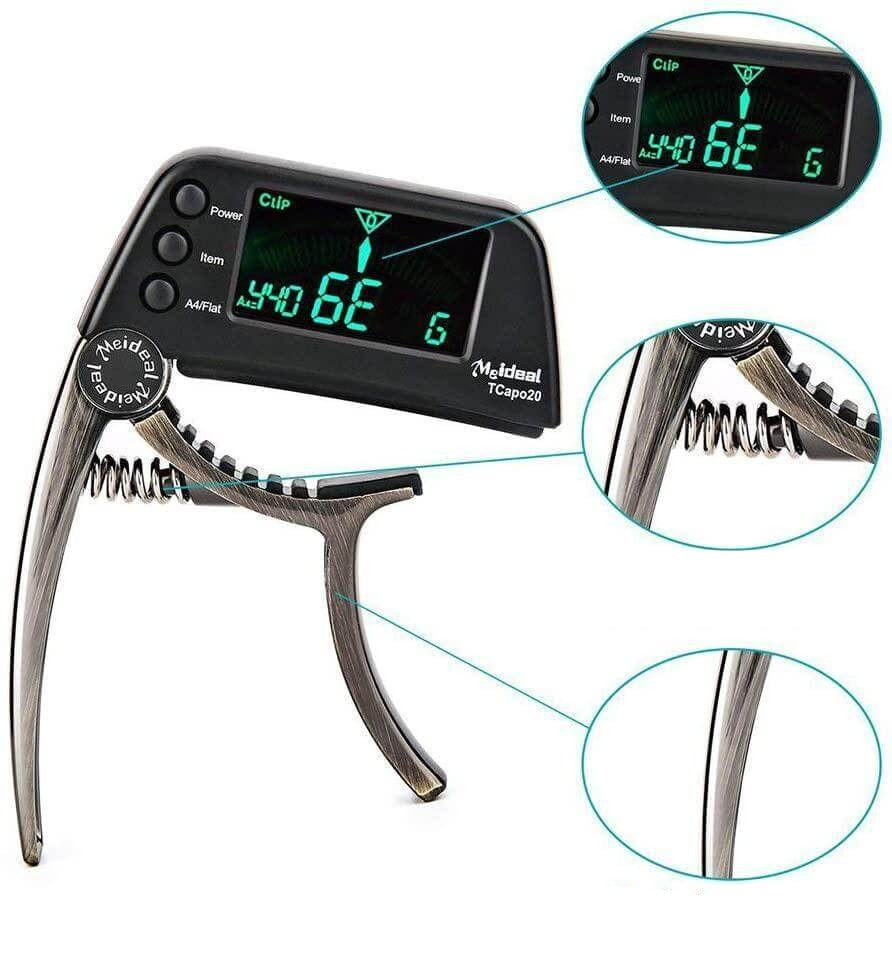 Black 2-in-1 guitar capo and digital tuner showing display screen and spring mechanism