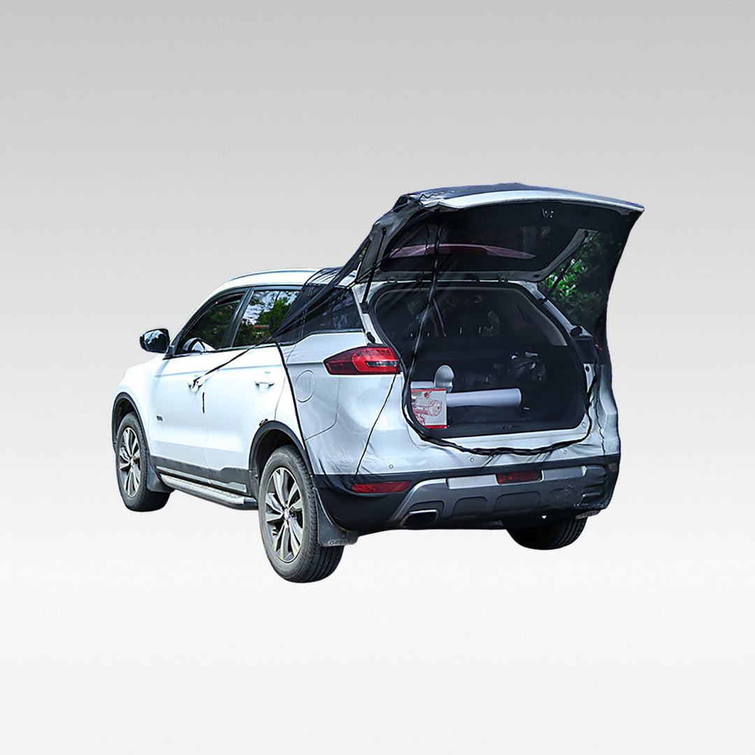 Car camping trunk mosquito net fitted over the rear hatch of a white SUV