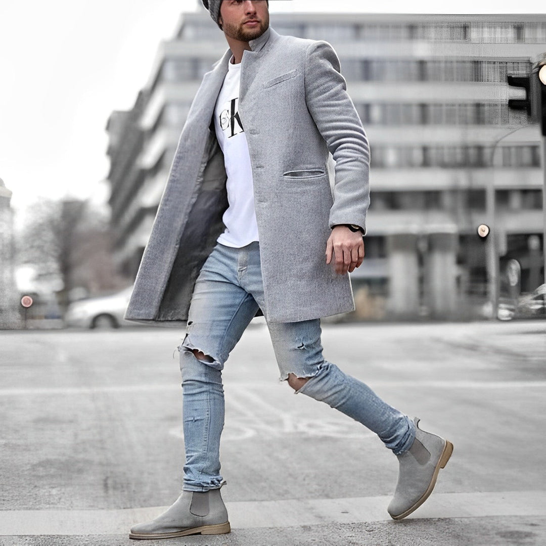 Man wearing a gray slim-fit topcoat with a stand collar