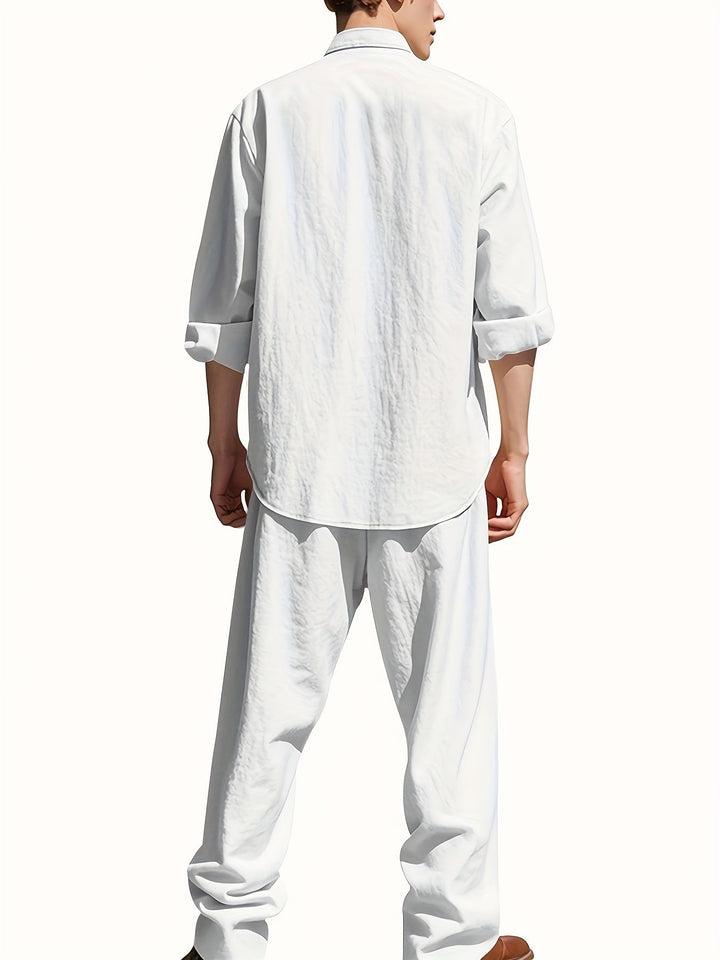 Man wearing Caspian white band collar long sleeve shirt and pants set from rear view
