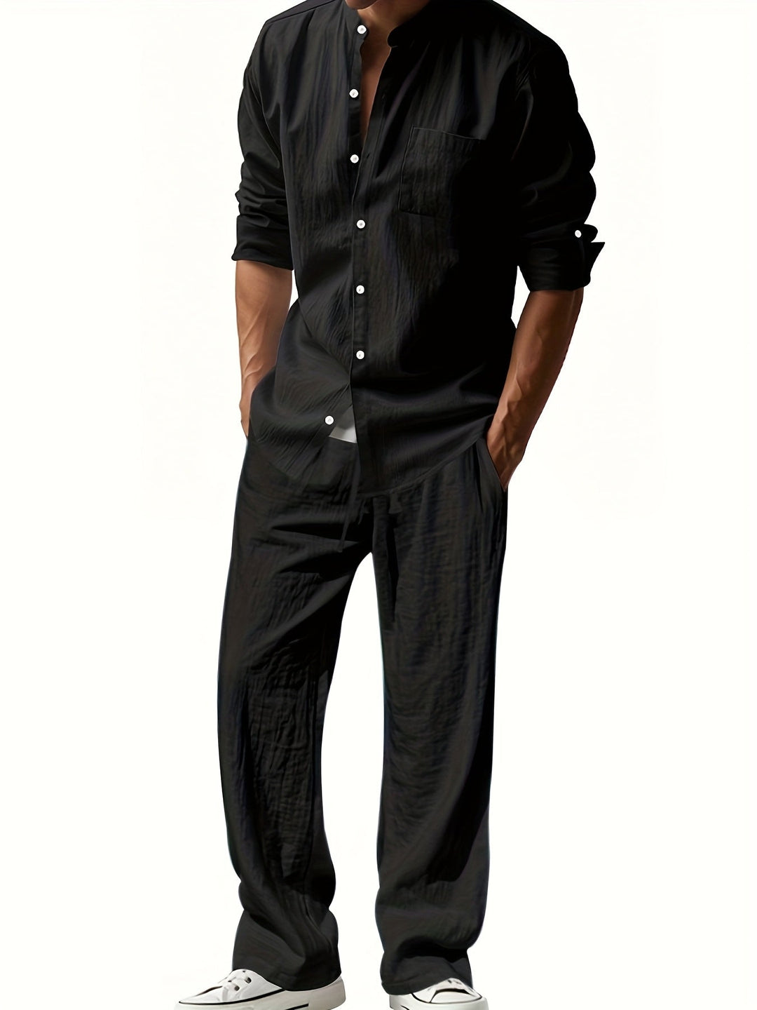 Man wearing Caspian black band collar long sleeve shirt and pants set from front view