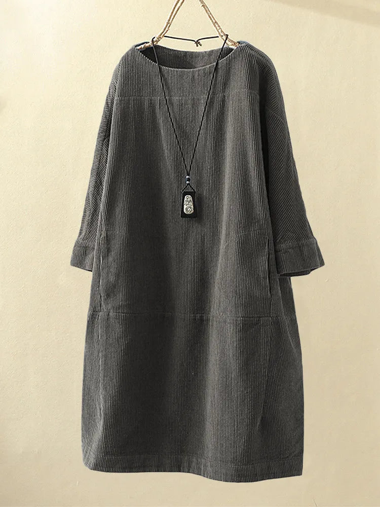 Gray women's casual textured dress hanging on display