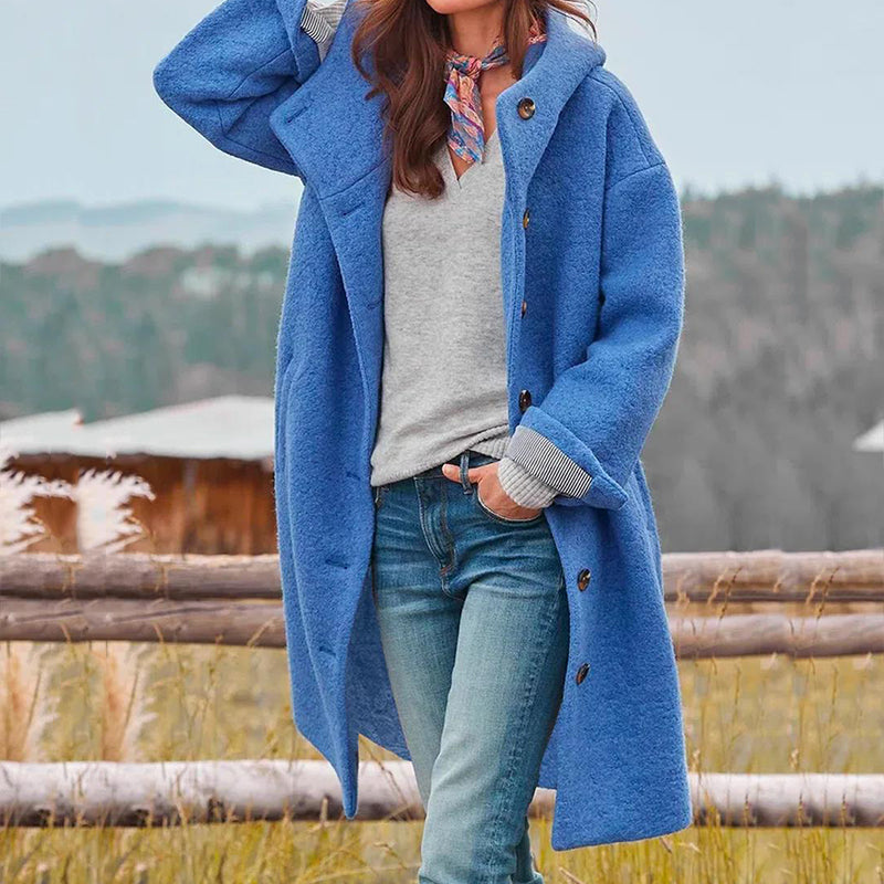 Woman wearing the blue Aria casual long hooded coat outdoors