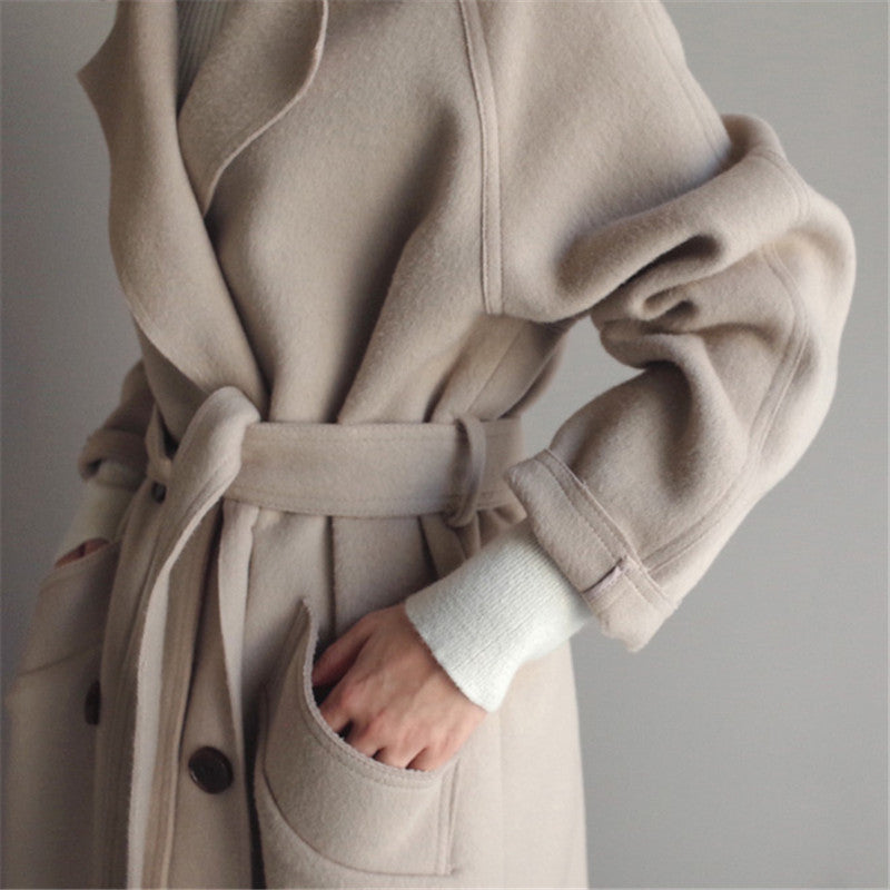 Detail of sleeve and pocket on Isabella beige coat