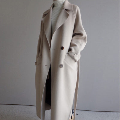 Front view of woman wearing Isabella beige long winter coat