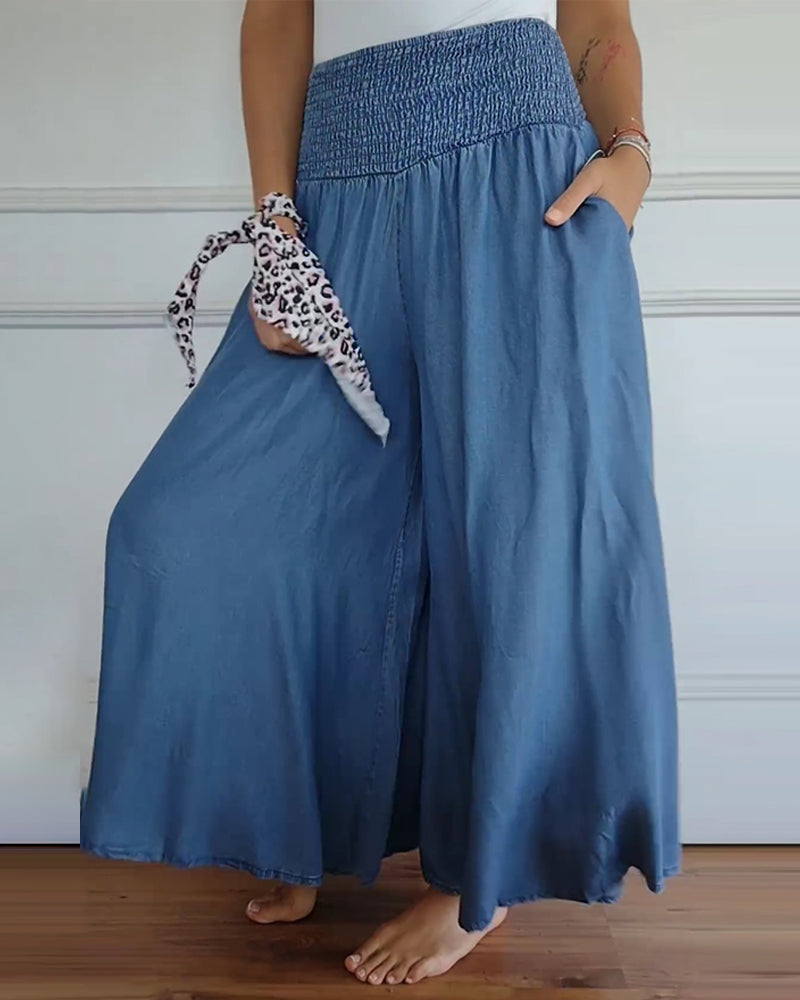 Woman wearing a blue flowy elastic waist skirt with pockets