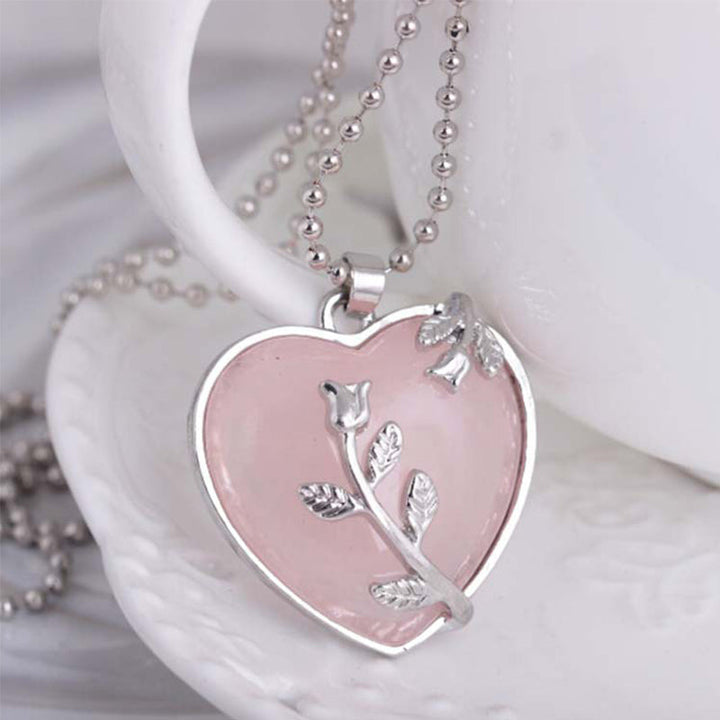 Women's heart gemstone pendant necklace close-up view showing crystal cut