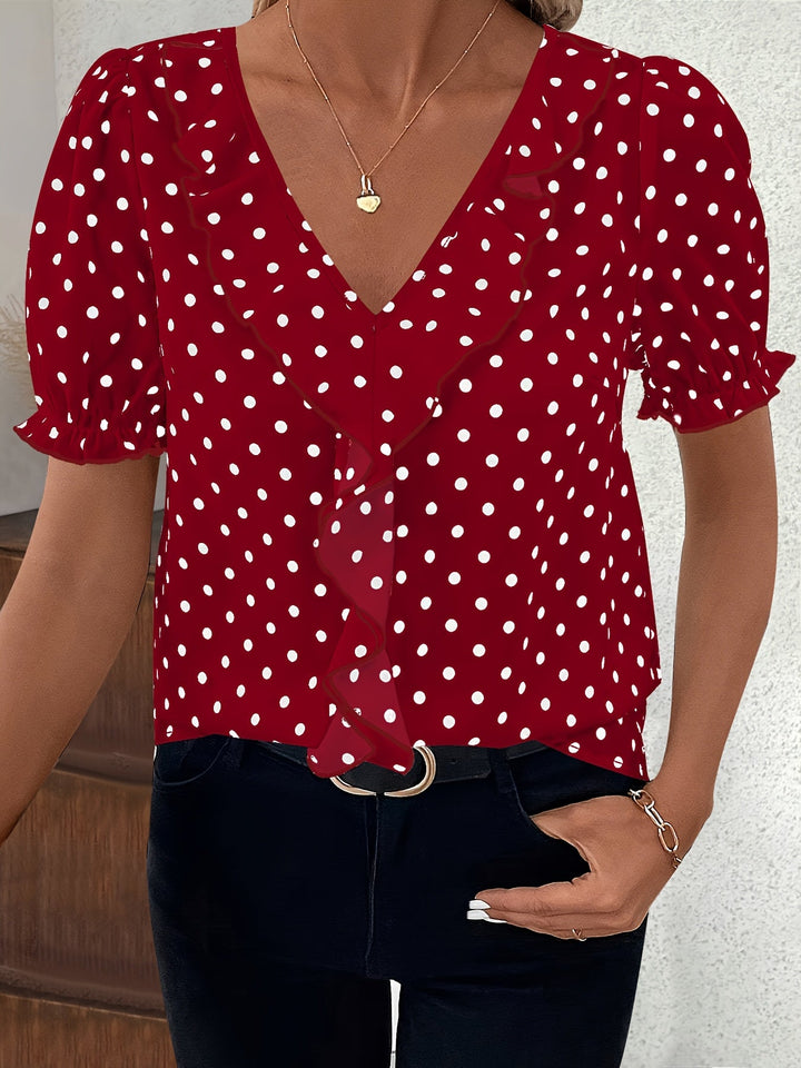 Statement blouse featuring trendy sheer bubble sleeves