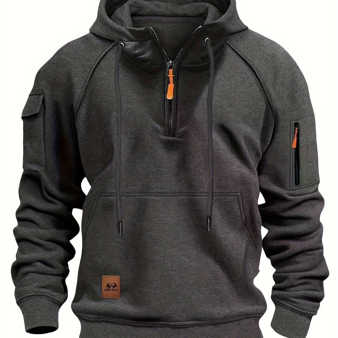 Men's utility hoodie packed neatly for travel and outdoor activities.