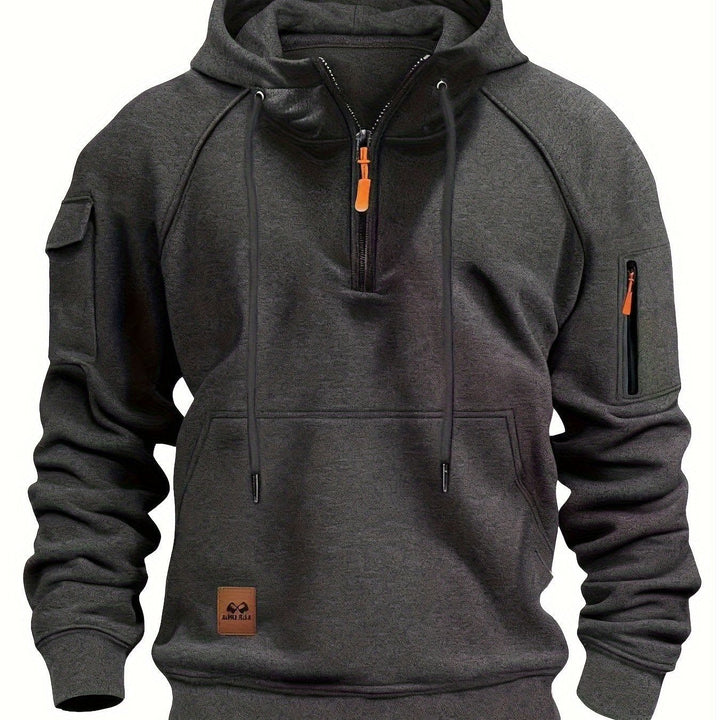 Men's utility hoodie packed neatly for travel and outdoor activities.