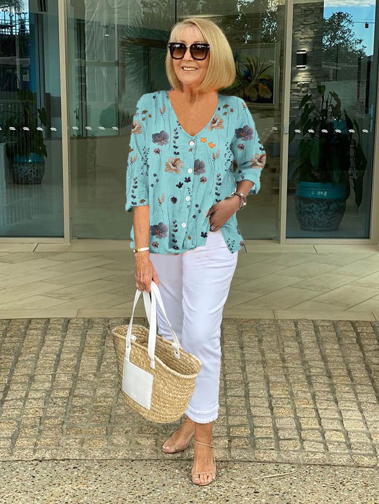 Close-up of floral pattern and V-neck detail on casual blouse
