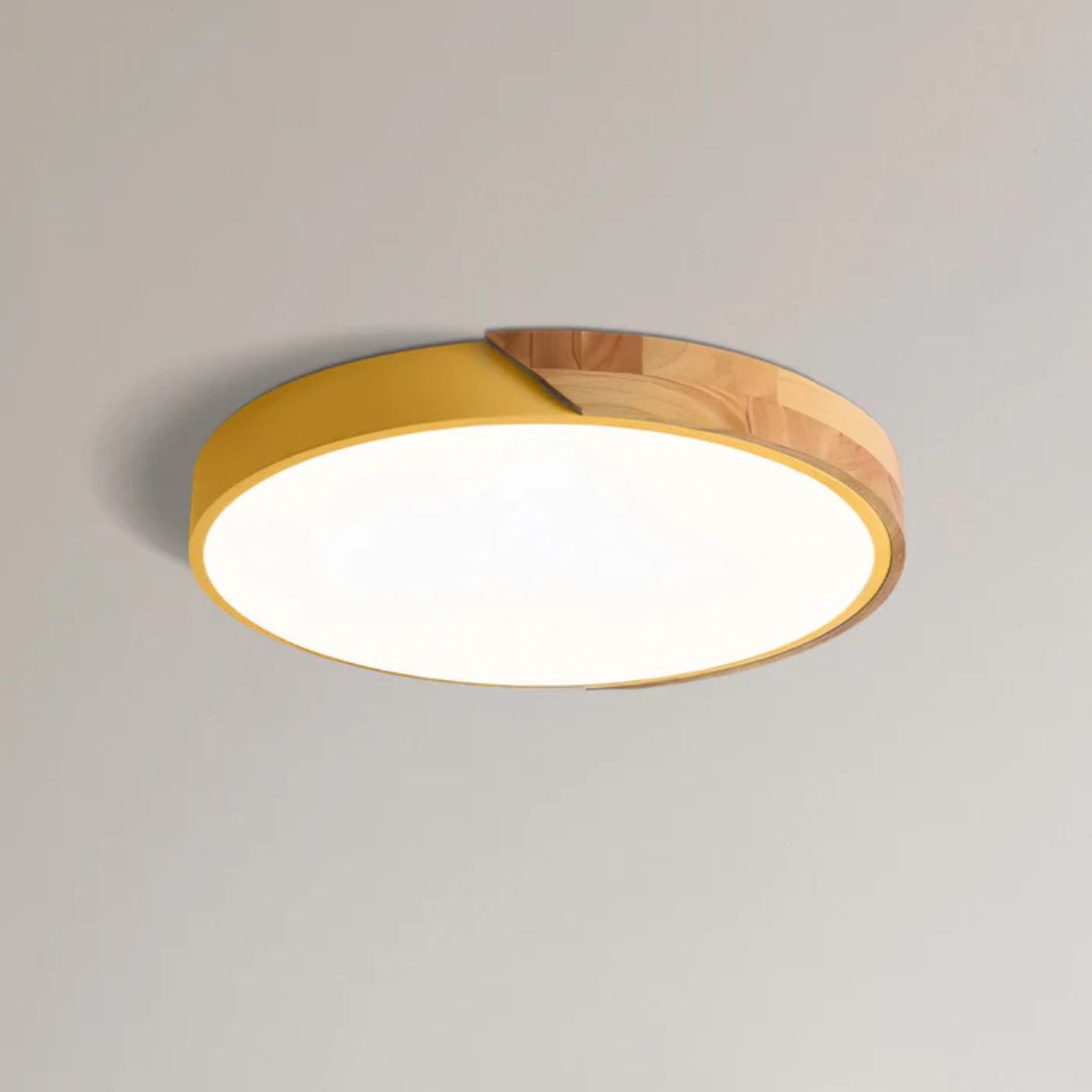 Warm ambiance scandinavian lighting emitted from a round wooden LED ceiling lamp