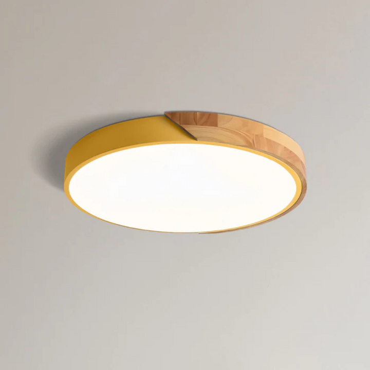 Warm ambiance scandinavian lighting emitted from a round wooden LED ceiling lamp