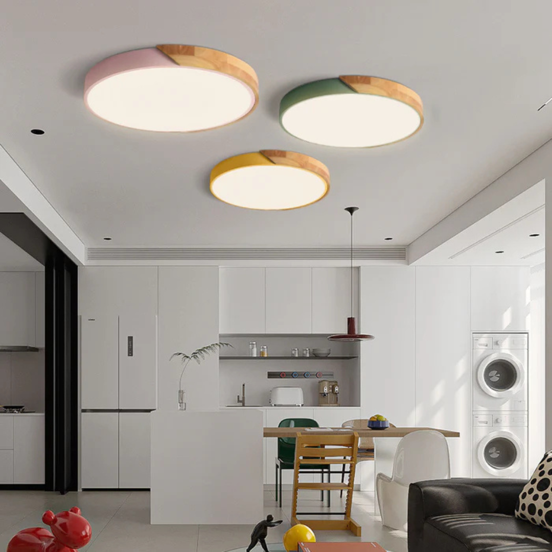 Interior design view of a wooden ceiling light illuminating a cozy modern dining room