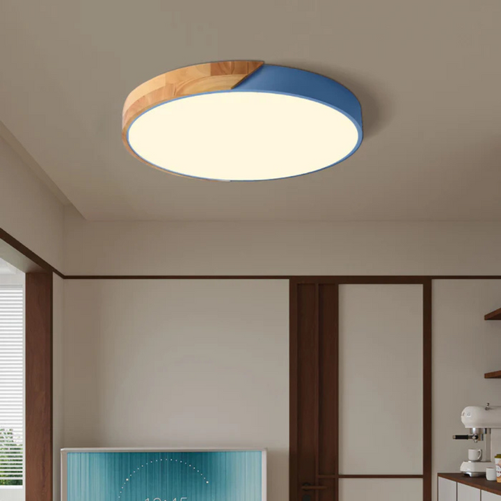 Low angle shot of the modern wooden LED ceiling lamp glowing softly in a hallway