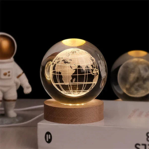 Detailed close-up of the crystal ball night light showing intricate space decor