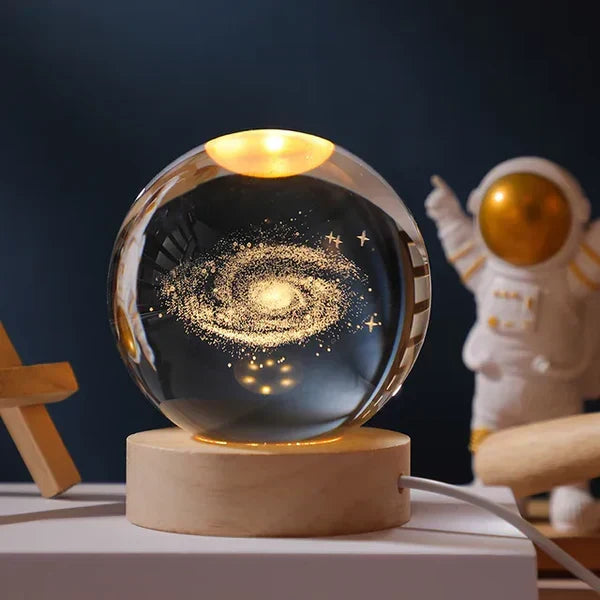 CelestialGlow Luminous Sphere illuminating a detailed Milky Way galaxy engraving