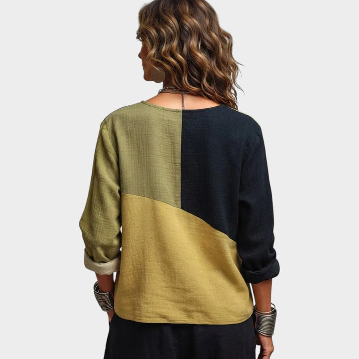 Back view of the women's asymmetric colourblock top showing the panel design