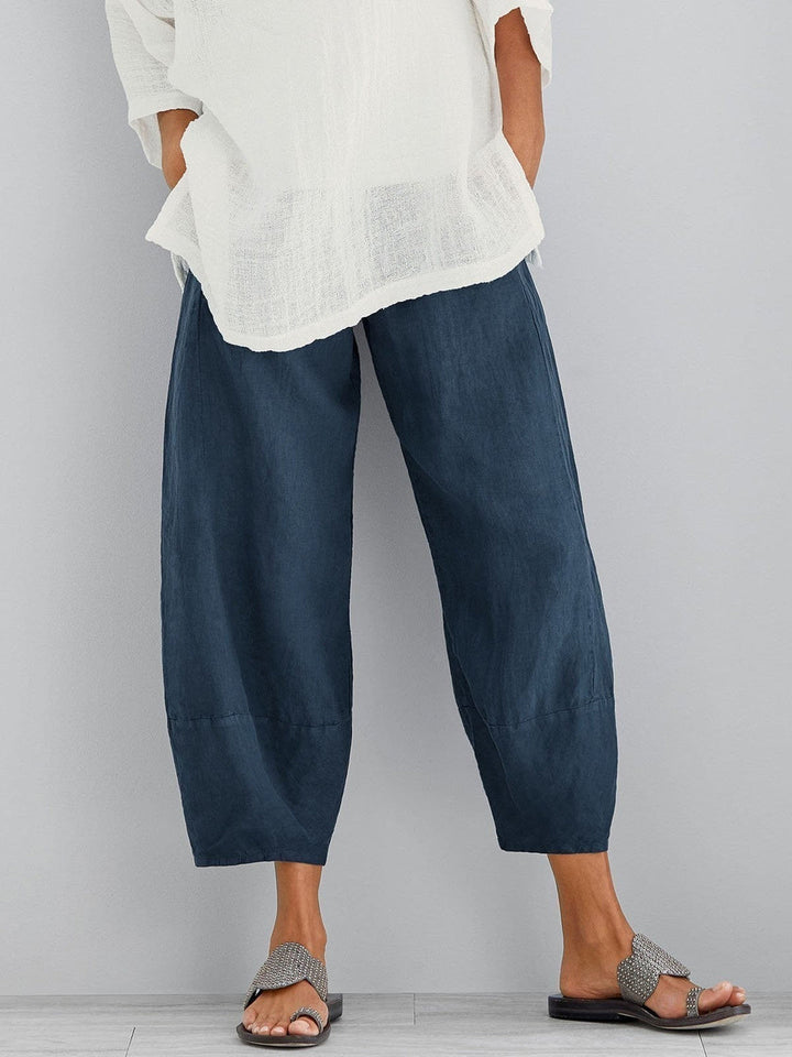 Back view of casual women's cropped trousers in solid hazel color with tailored waistband